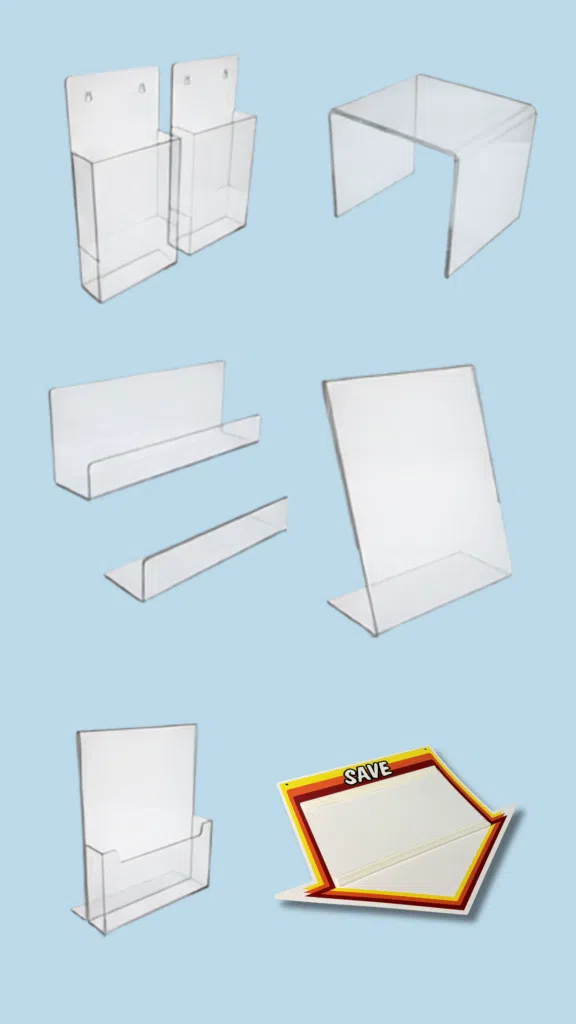 Acrylic Sign Holder Displays | BAW Plastics Inc. | BAW Plastics Inc. Assorted clear acrylic brochure and sign stands on a blue background.