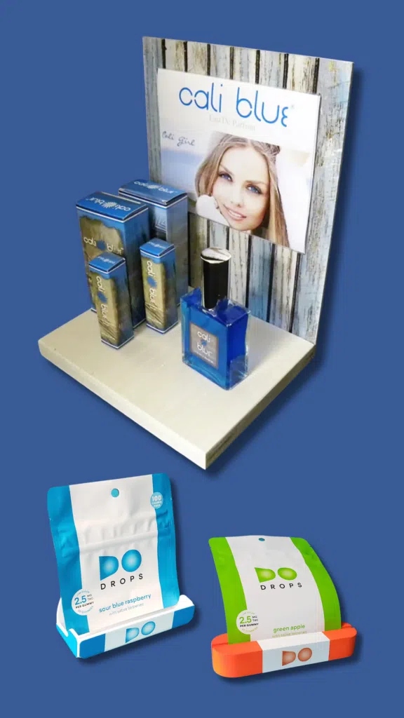 Cali Blue Skincare Display | BAW Plastics Inc. | BAW Plastics Inc. Promotional display of Cali Blue perfume with blue boxed products on a white stand.