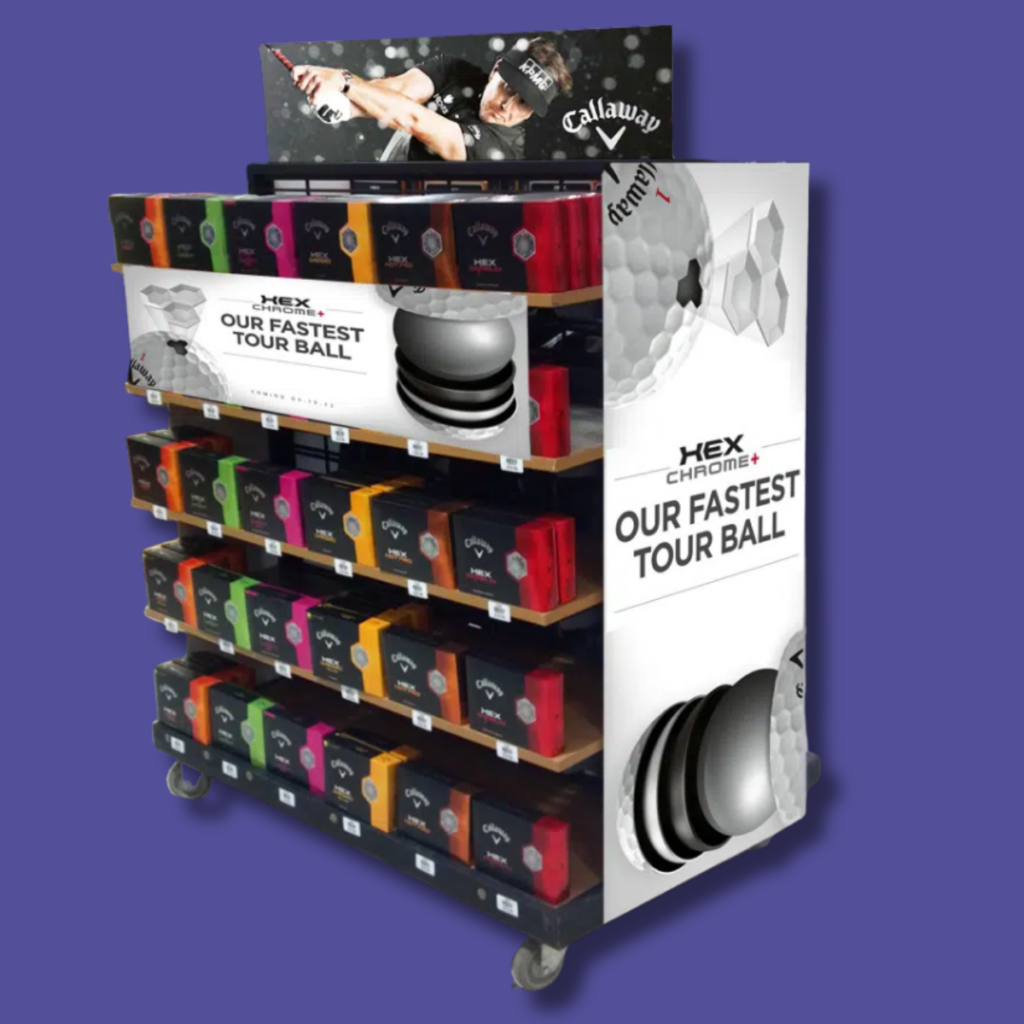 Golf Ball Floor Display | BAW Plastics Inc. | BAW Plastics Inc. Multi-tier golf ball display rack on wheels, with colorful boxed balls and a large 'Our Fastest Tour Ball' banner on the side.