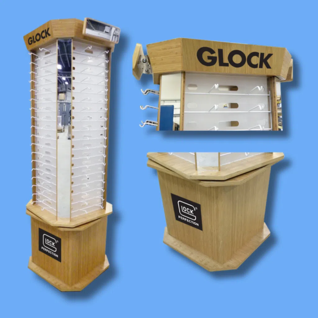 Wooden Glock-branded retail display | BAW Plastics Inc. | BAW Plastics Inc. Wooden Glock-branded retail display with multiple hook racks for firearms, shown against a blue background (tall tower).