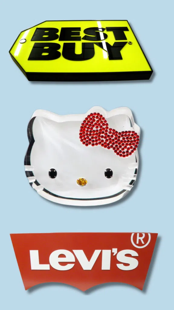 Best Buy Signage, Hello Kitty and Levi's Signs | BAW Plastics Inc. | BAW Plastics Inc. Collage showing a yellow Best Buy sign, a Hello Kitty plate with a red rhinestone bow, and a red Levi's logo on a blue background.